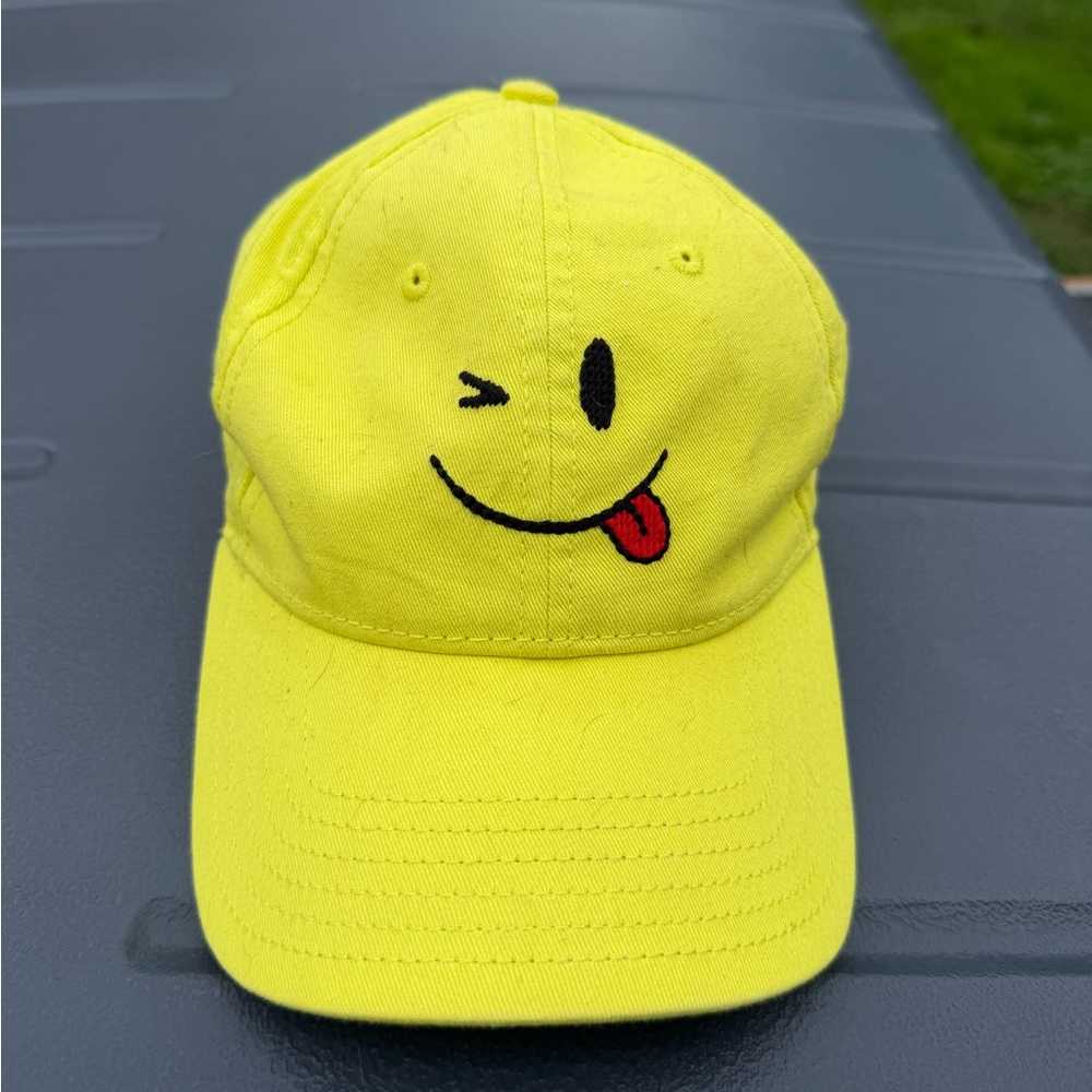 Yellow Smiley Face Cap by Opening Ceremony and Harding Lane. Needle point design